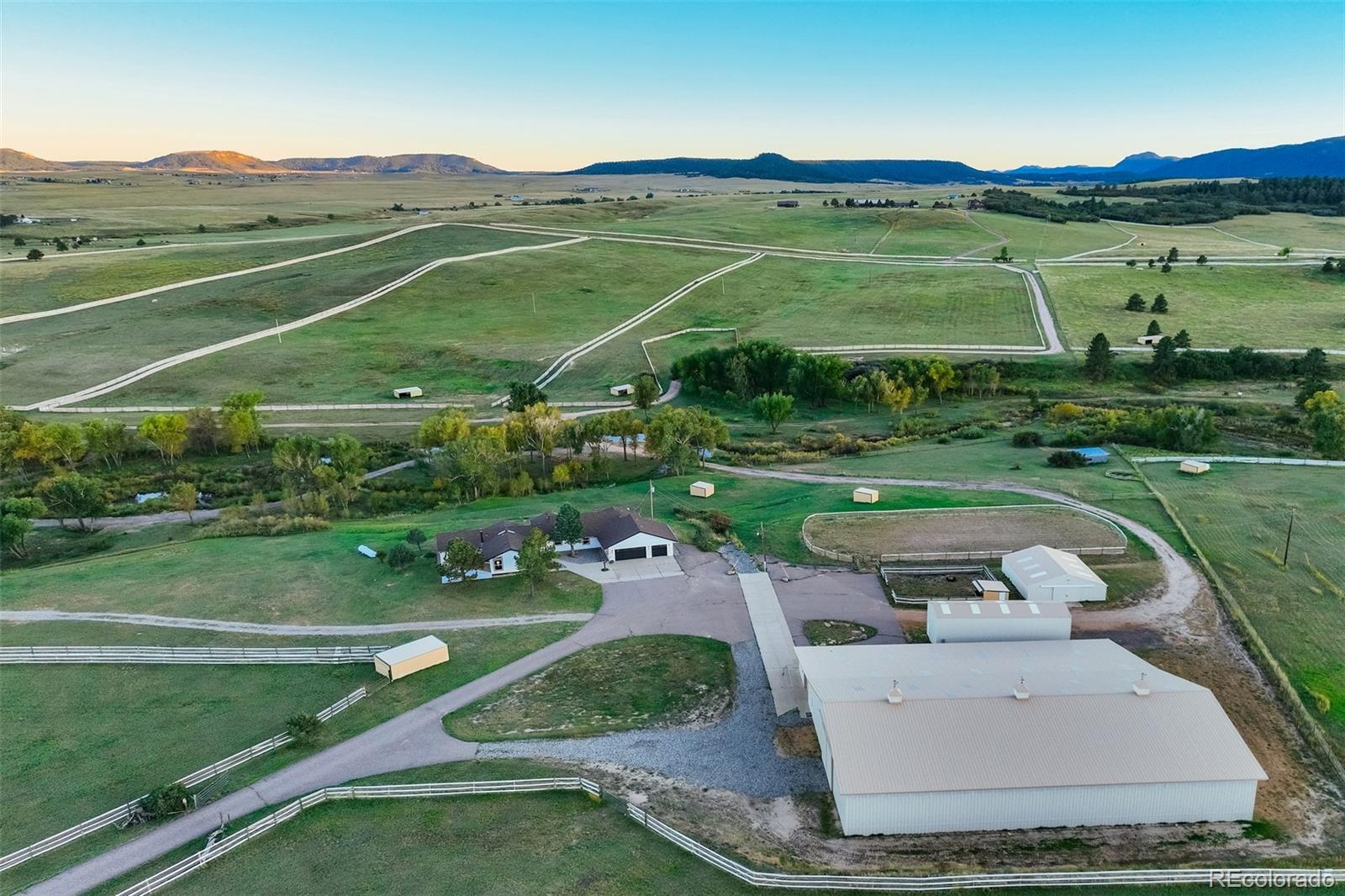 850 West Fox Farm Road Larkspur, CO 80118 - Photo 4 of 50 an aerial view of a golf course with a garden