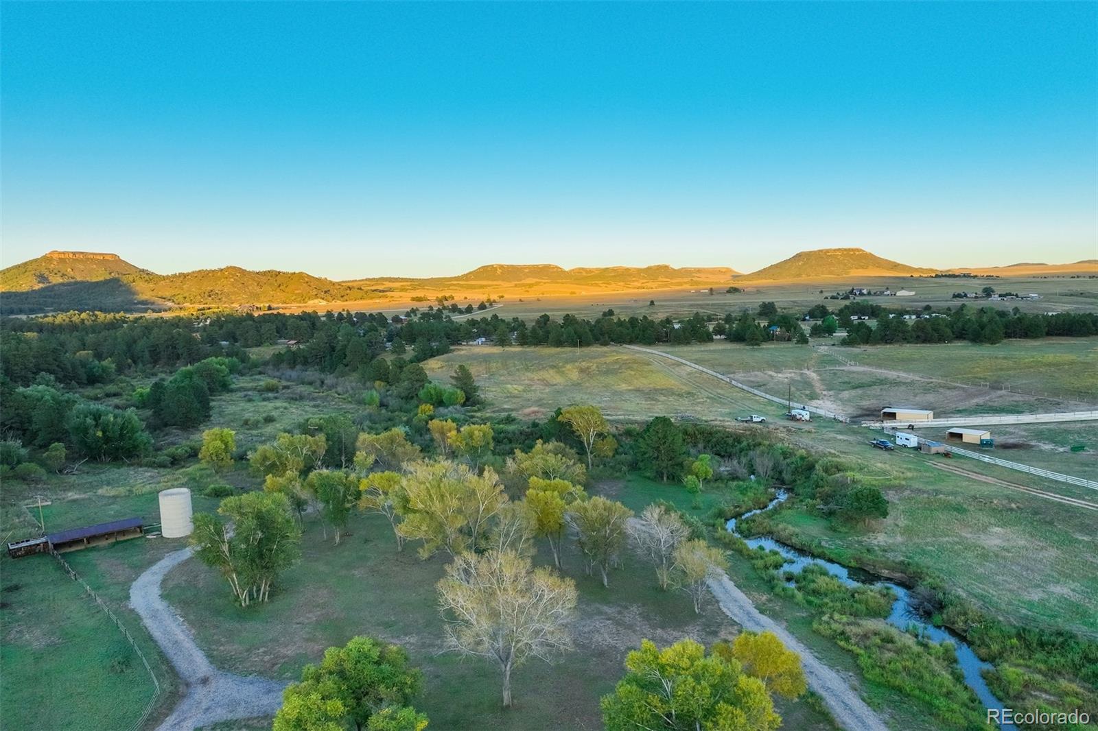 850 West Fox Farm Road Larkspur, CO 80118 - Photo 42 of 50 a view of a lake with mountains in the background