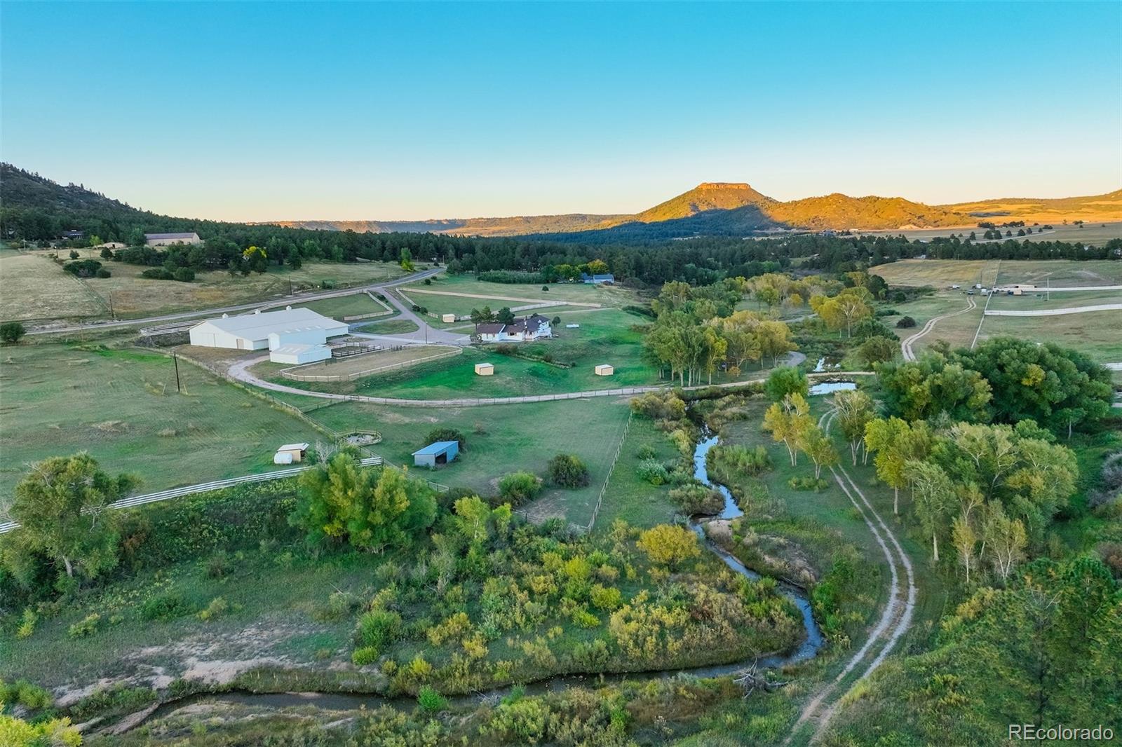 850 West Fox Farm Road Larkspur, CO 80118 - Photo 50 of 50 a view of a lush green hillside and houses
