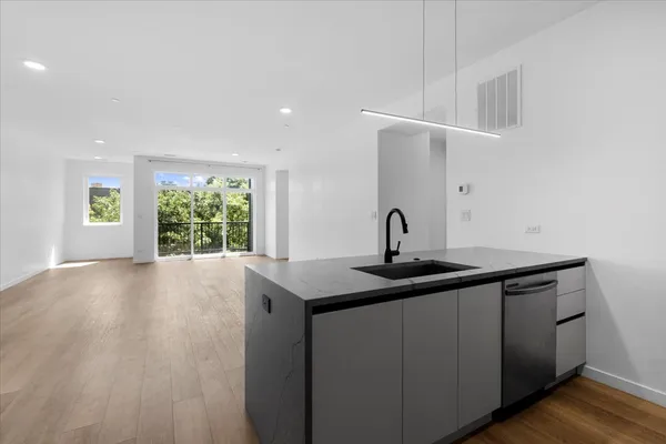 a view of a sink and a window in a room