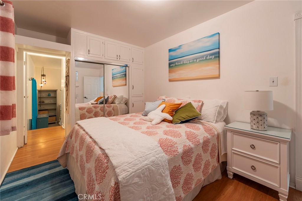 1728 The Strand, Unit 1 Hermosa Beach, CA 90254 - Photo 14 of 16 a bed room with a bed and a dresser