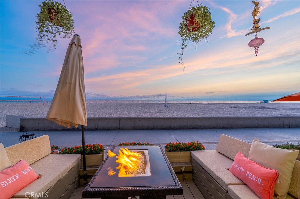 1728 The Strand, Unit 1 Hermosa Beach, CA 90254 - Photo 2 of 16 a view of a swimming pool with a couch and wooden floor