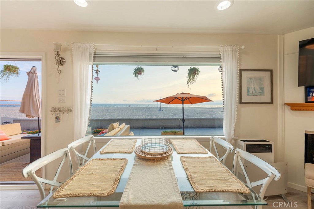 1728 The Strand, Unit 1 Hermosa Beach, CA 90254 - Photo 3 of 16 view of living room with furniture and a table