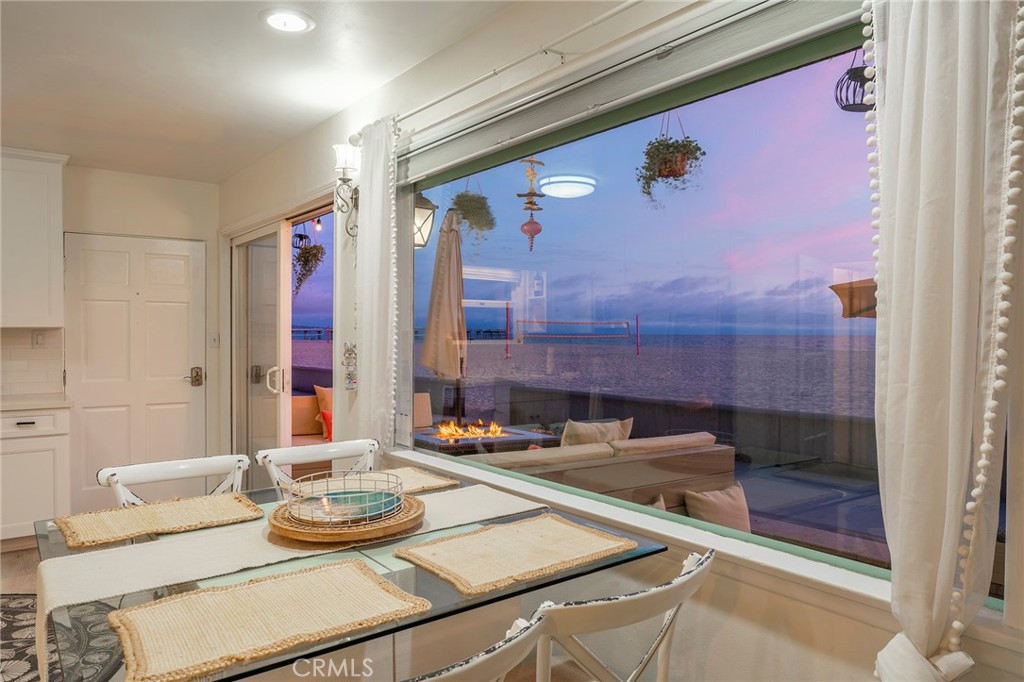 1728 The Strand, Unit 1 Hermosa Beach, CA 90254 - Photo 4 of 16 a bathroom with a granite countertop sink and a mirror