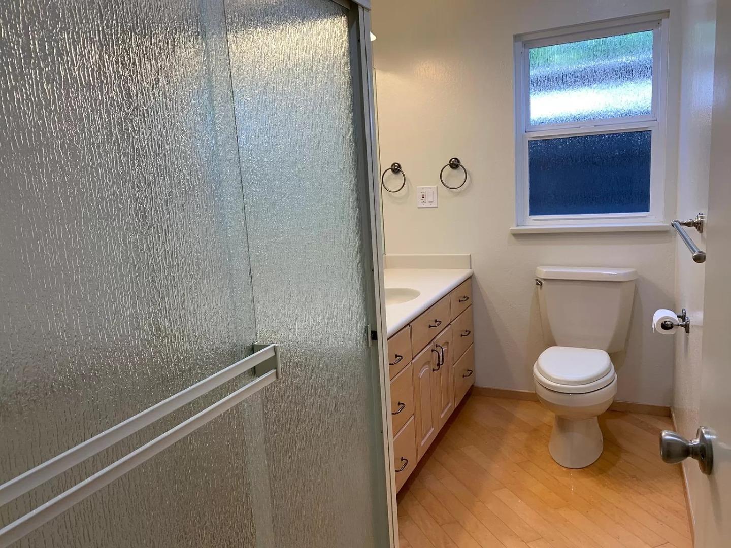 1170 Oakwood Drive Millbrae, CA 94030 - Photo 11 of 13 a bathroom with a toilet sink and mirror