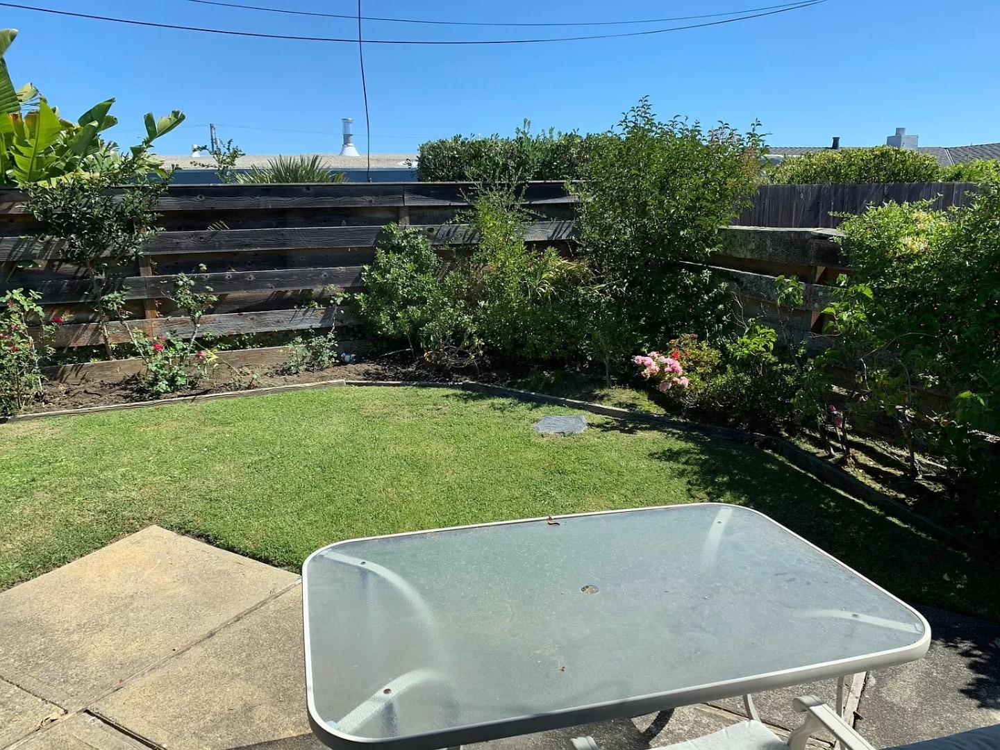 1170 Oakwood Drive Millbrae, CA 94030 - Photo 13 of 13 a view of a swimming pool and a yard