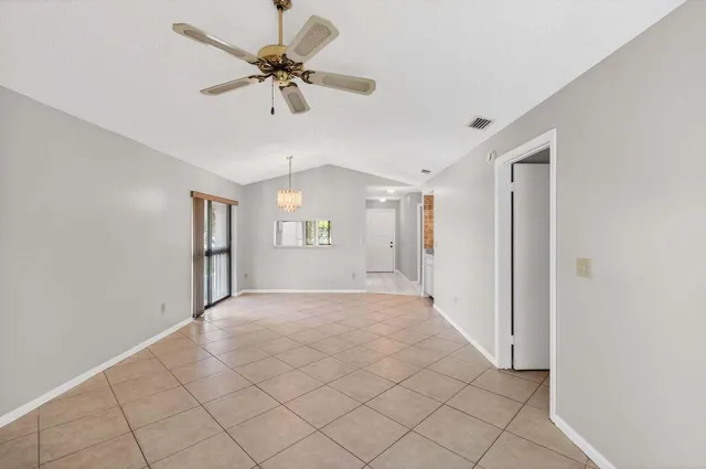 a bedroom with a large bed and a flat screen tv