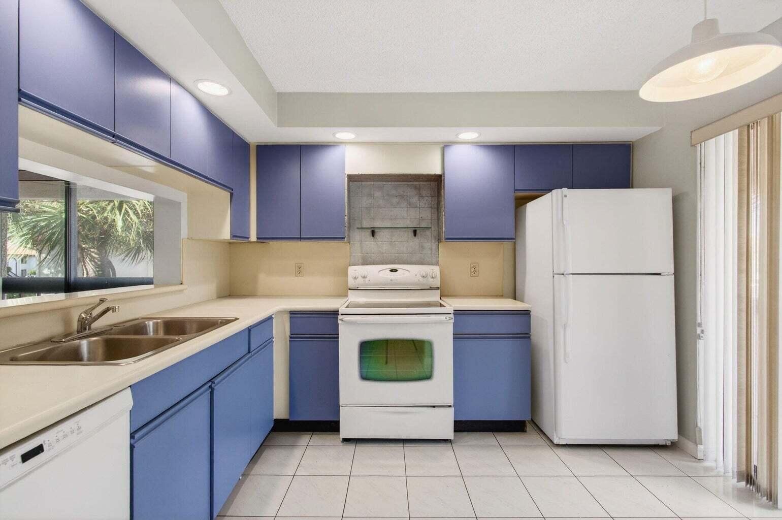 400 Club Circle, Unit 201 Boca Raton, FL 33487 - Photo 21 of 64 a kitchen with a refrigerator sink and stove