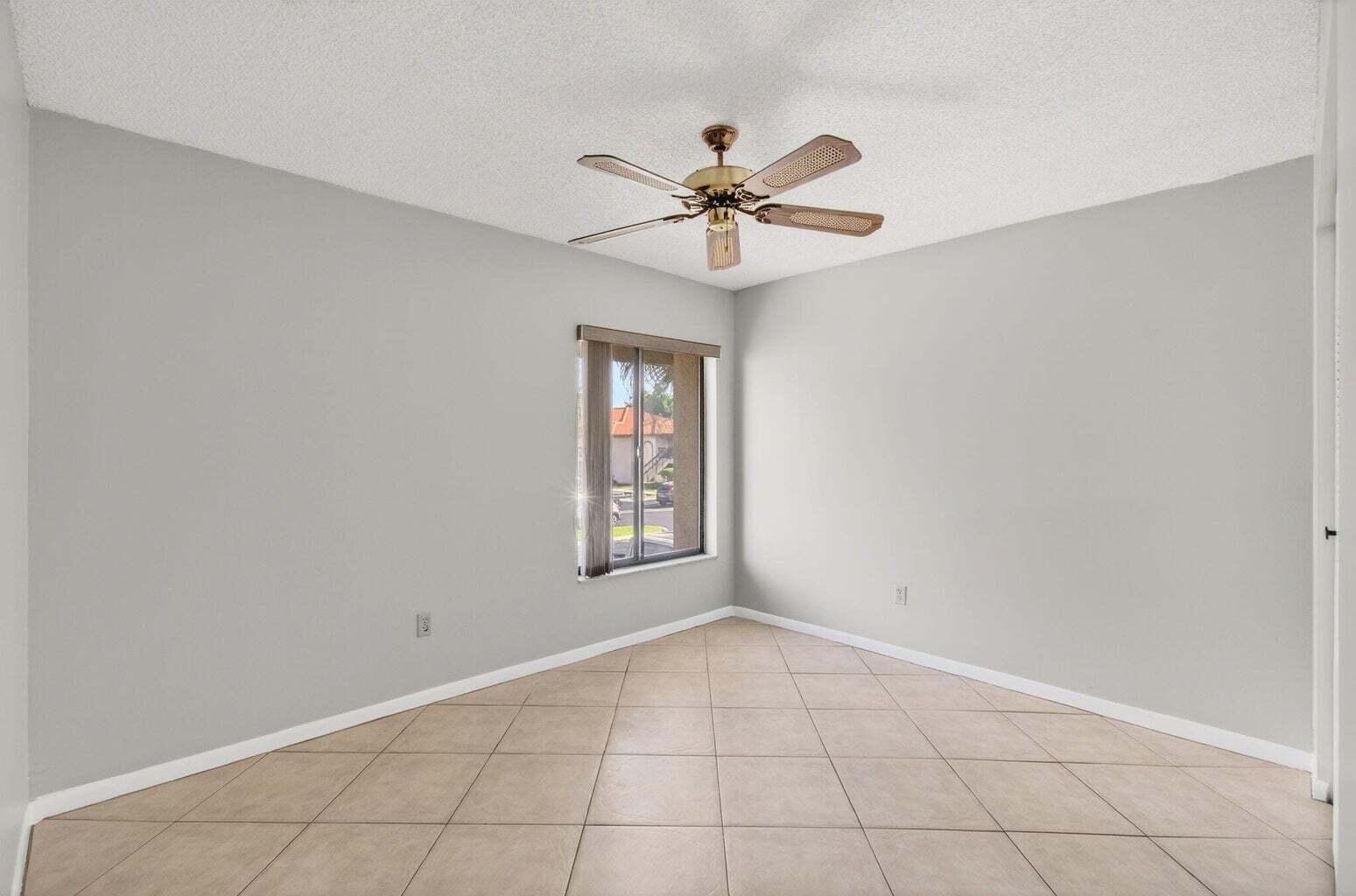 400 Club Circle, Unit 201 Boca Raton, FL 33487 - Photo 29 of 64 a view of an empty room with a window