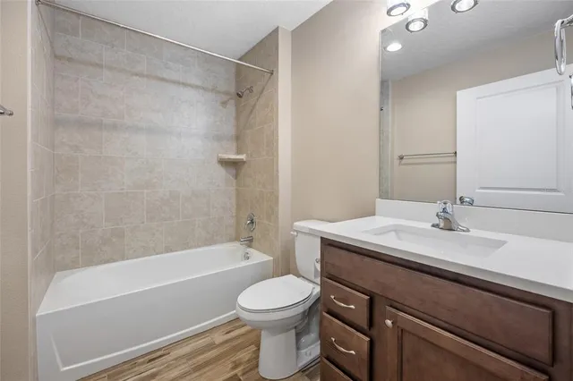 a bathroom with a sink a toilet and a bathtub