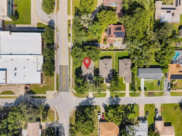 an aerial view of a house with a swimming pool