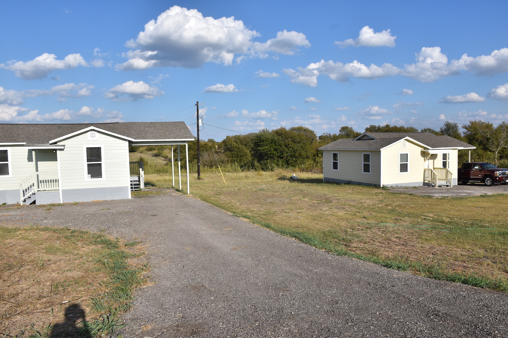 3751 County Road 463 Elgin, TX 78621 - Photo 3 of 27 a view of a house with backyard and a garden