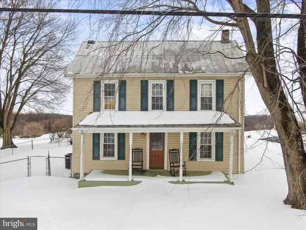 a front view of a house with a porch