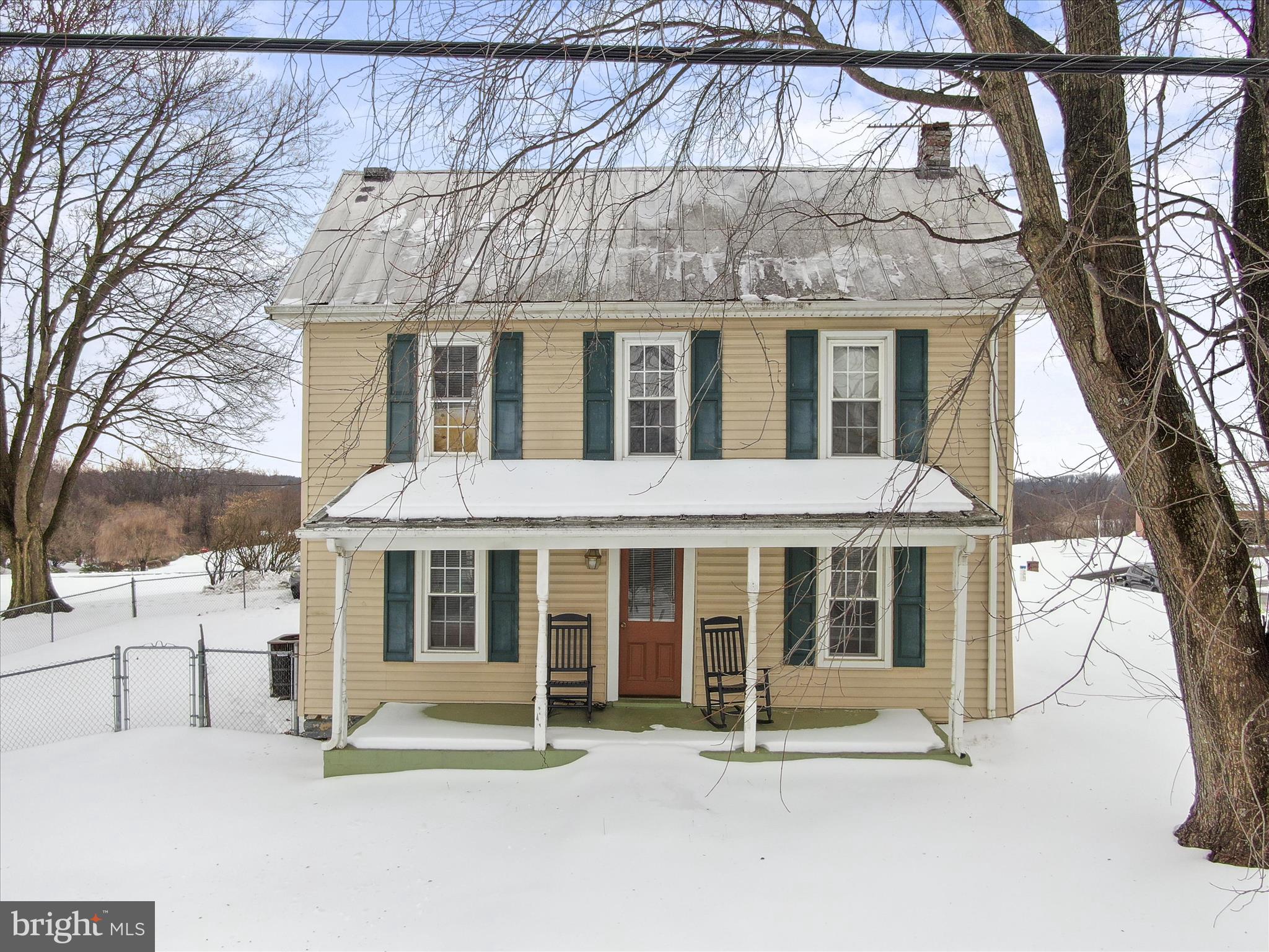 a front view of a house with a porch
