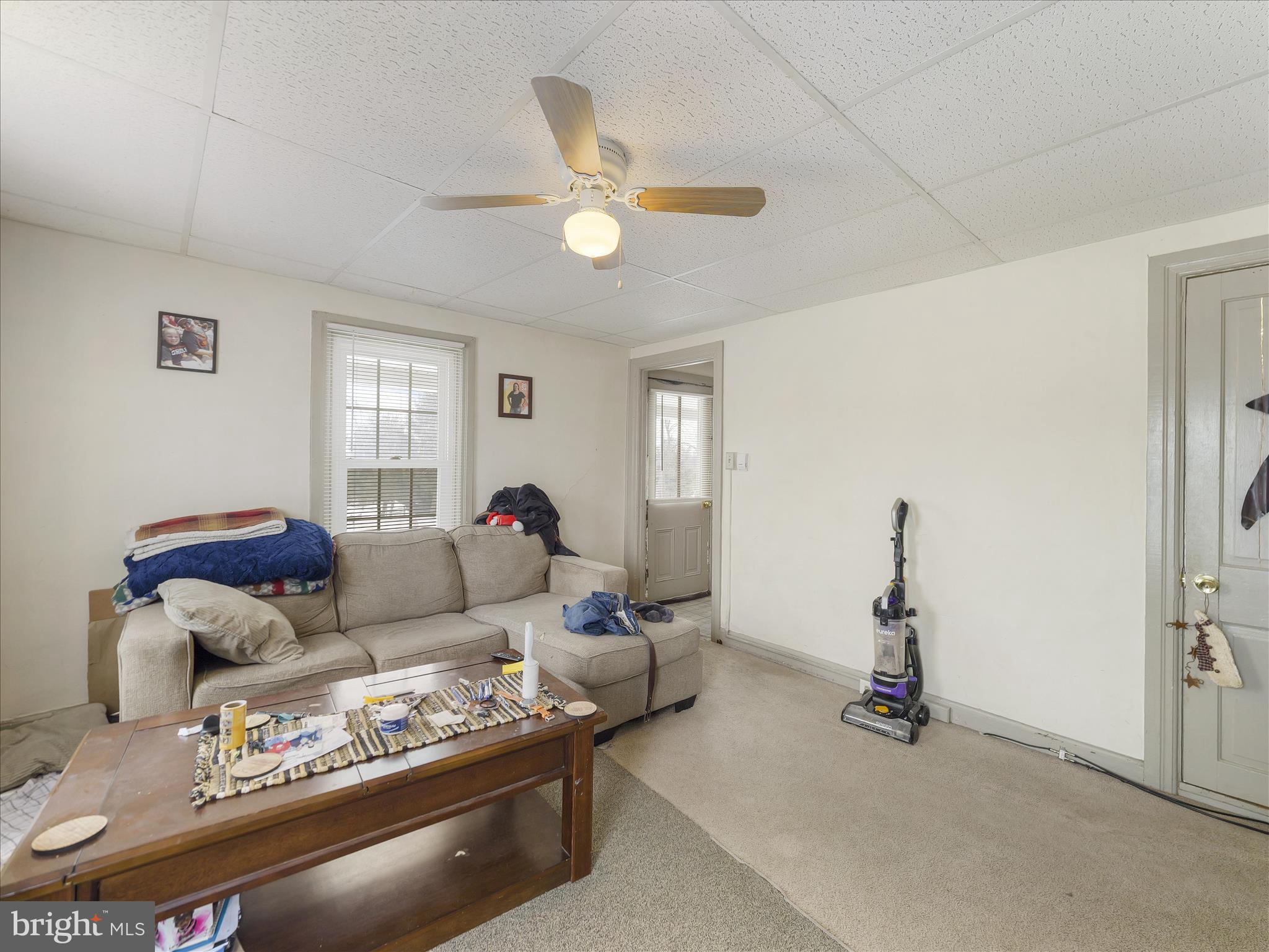 13643 Creek View Drive Clear Spring, MD 21722 - Photo 12 of 49 a living room with furniture a window and a chandelier