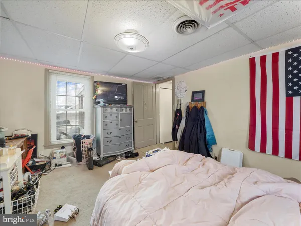 a bed room with a bed and a window