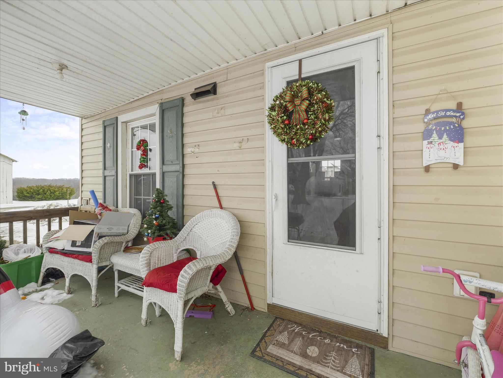 13643 Creek View Drive Clear Spring, MD 21722 - Photo 19 of 49 a balcony with furniture and a potted plant