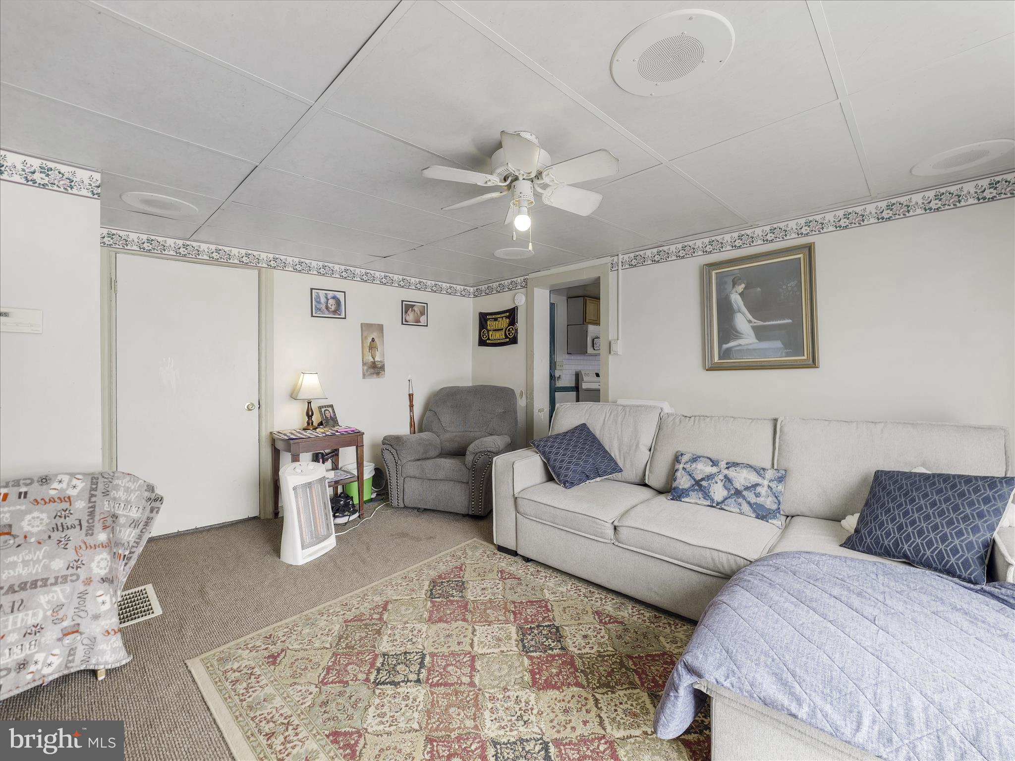 13643 Creek View Drive Clear Spring, MD 21722 - Photo 26 of 49 a living room with furniture and a rug
