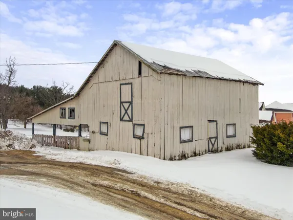 a view of a house with a snow in the yard