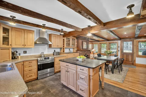 a kitchen with stainless steel appliances granite countertop a stove and a refrigerator