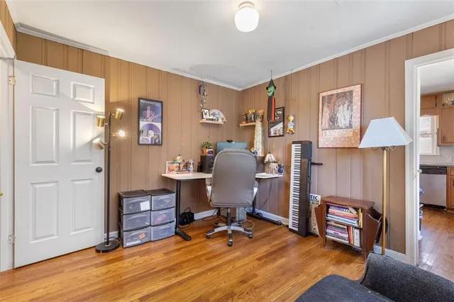 a workspace with furniture and wooden floor