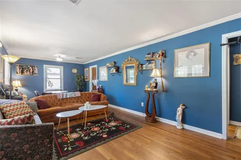 a living room with furniture rug and window