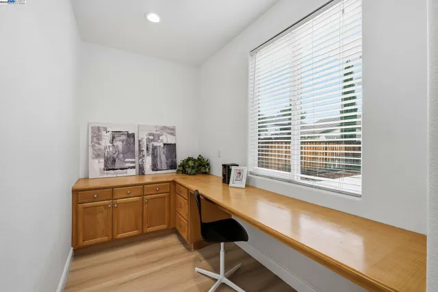 a room with a large window and table