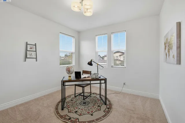 a workspace with furniture and window