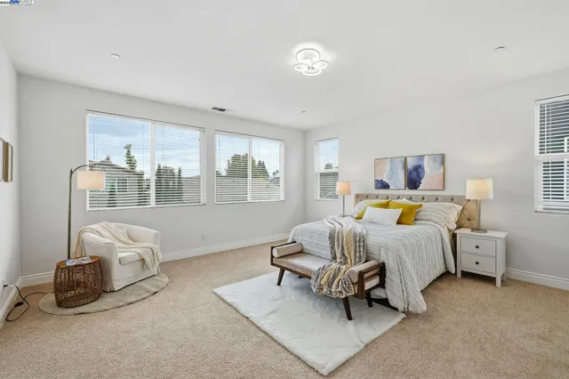 a bedroom with bed and a window