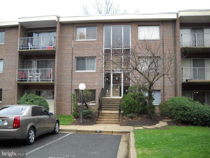 3814 Bel Pre Road, Unit 359 Silver Spring, MD 20906 - Photo 1 of 8 a view of a cars park in front of a building