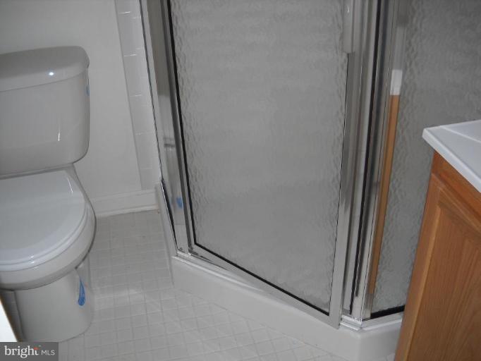 3814 Bel Pre Road, Unit 359 Silver Spring, MD 20906 - Photo 5 of 8 a bathroom with a toilet and a shower