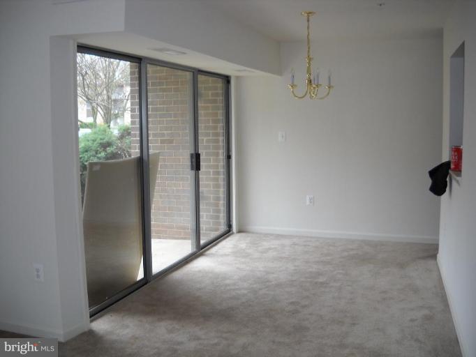 3814 Bel Pre Road, Unit 359 Silver Spring, MD 20906 - Photo 8 of 8 an empty room with windows