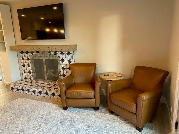 a living room with a couch and two stove top oven