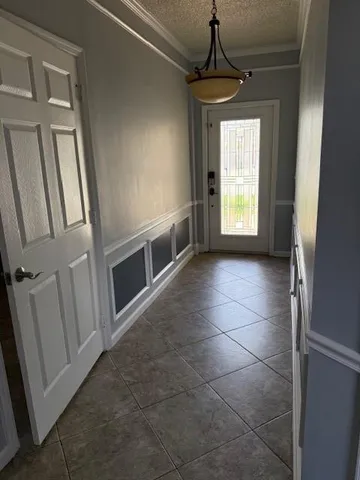 a view of a kitchen from the empty room