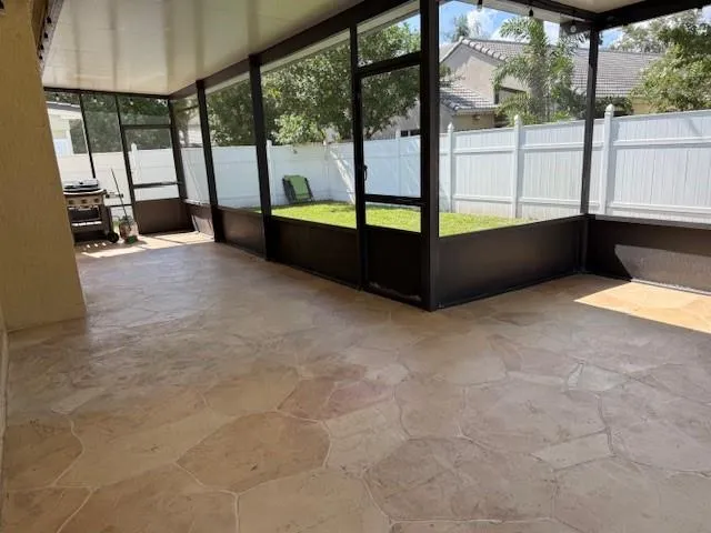 a living room with a large window and a table