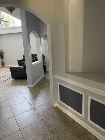 a view of living room with furniture and flat screen tv