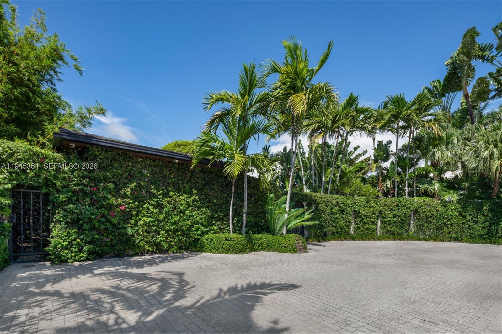 1155 North Biscayne Point Road Miami Beach, FL 33141 - Photo 1 of 1 a plant is in front of a yard