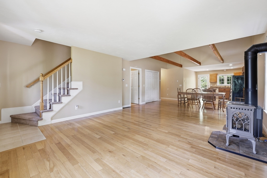 9 Rock Marsh Road, Unit B Wareham, MA 02571 - Photo 8 of 41 a view of a livingroom with dining room and hardwood floor