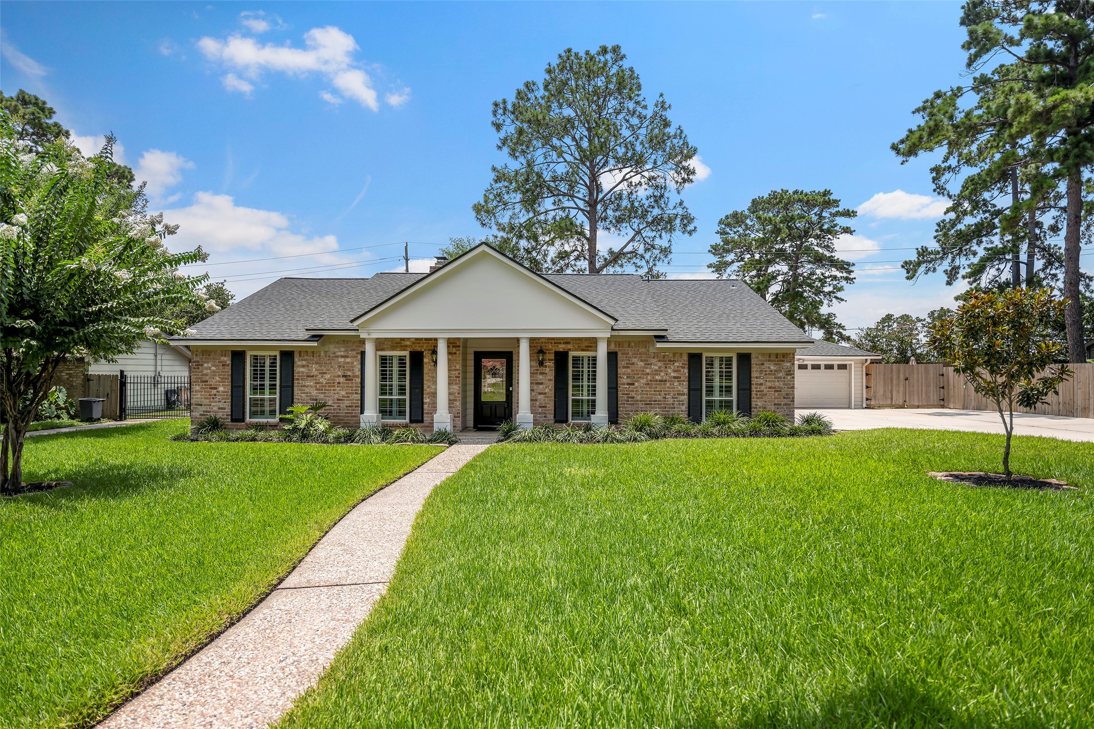 6507 Allentown Drive Spring, TX 77389 - Photo 26 of 30 Front of Home with pebble walkway and beautifull landscaping