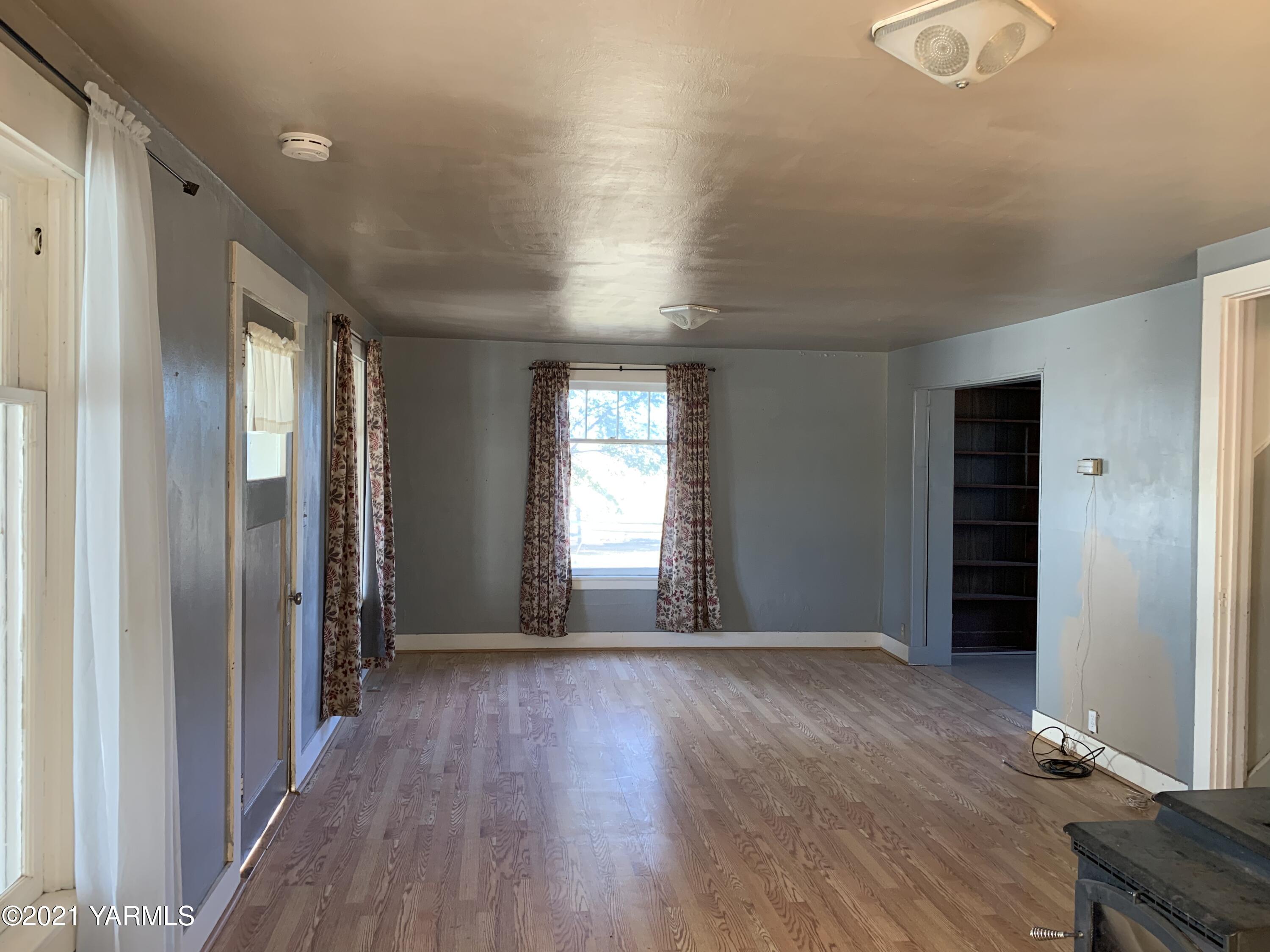753 Wesley Road White Swan, WA 98952 - Photo 20 of 30 a view of livingroom with hardwood floor and window