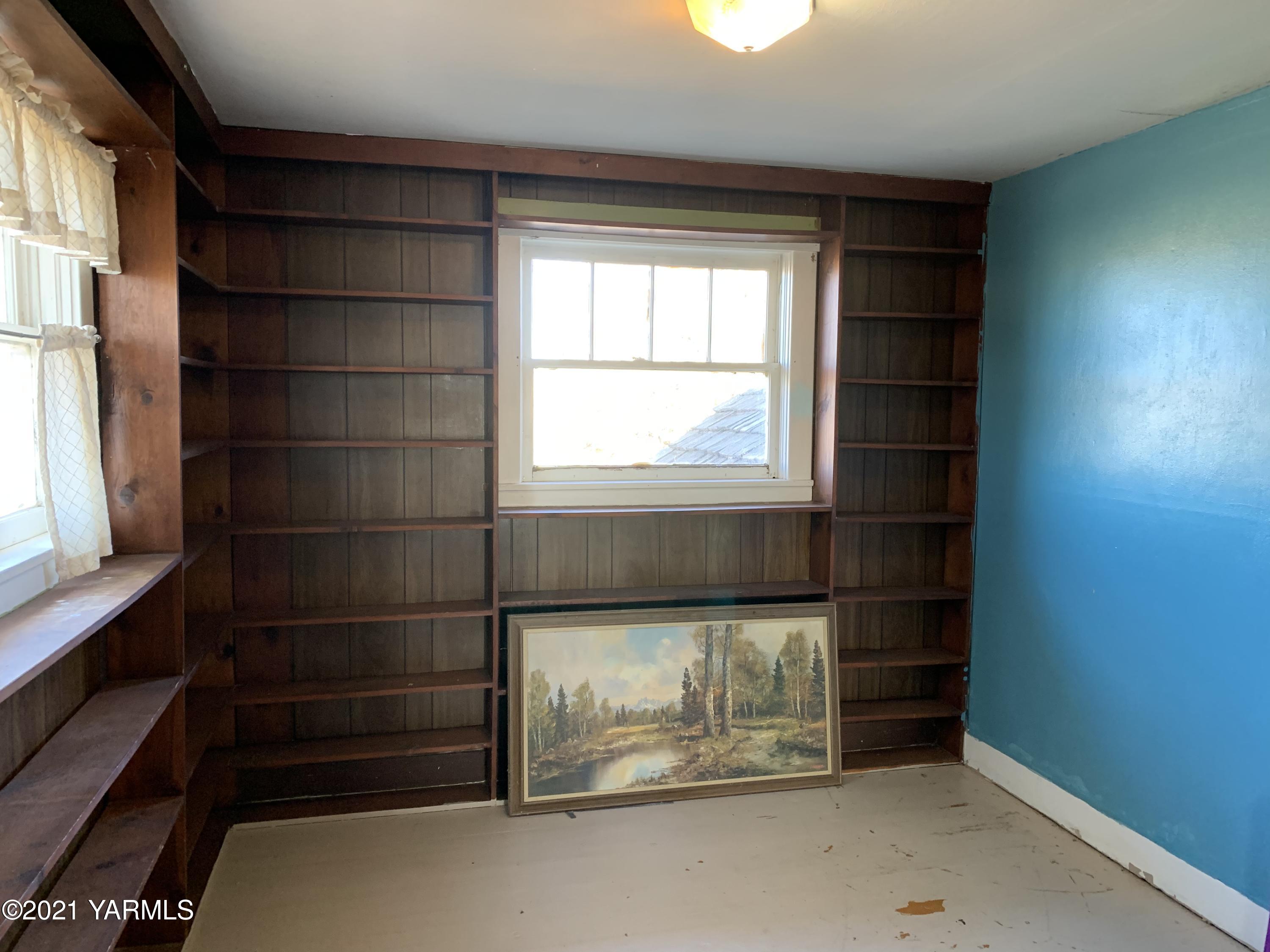 753 Wesley Road White Swan, WA 98952 - Photo 21 of 30 an empty room with wooden floor and windows