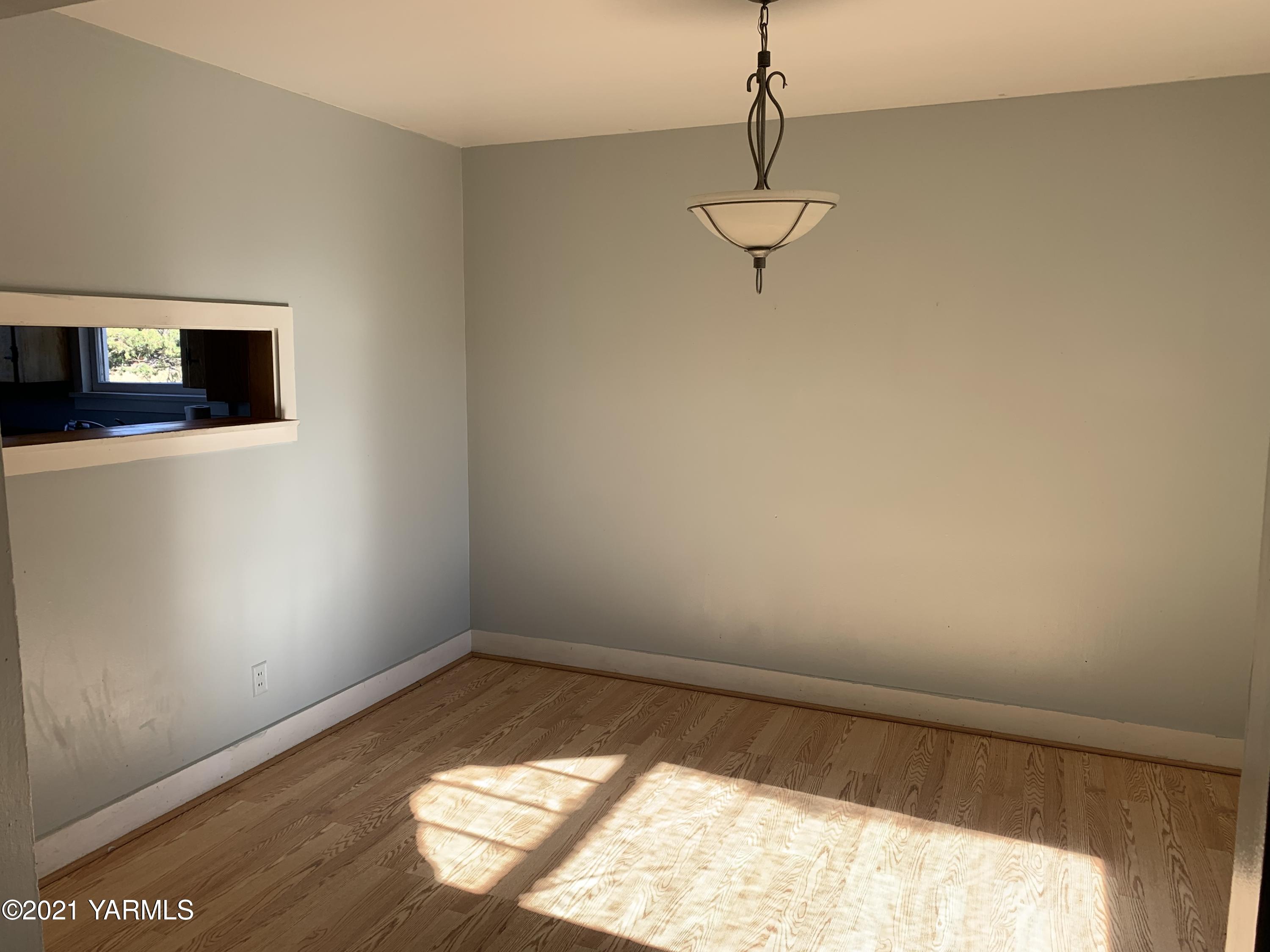 753 Wesley Road White Swan, WA 98952 - Photo 23 of 30 a view of a room with wooden floor and windows