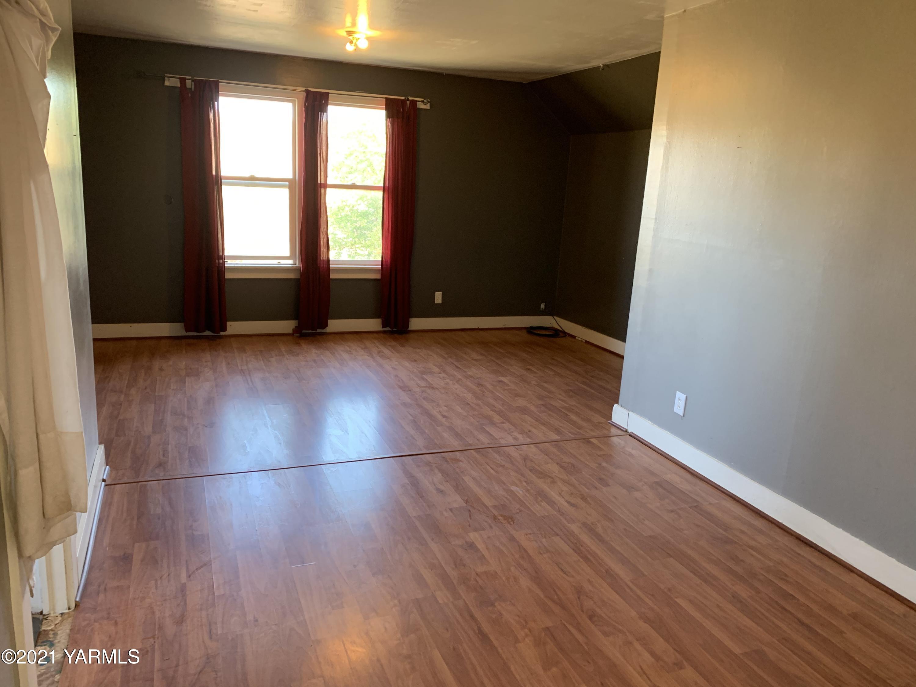 753 Wesley Road White Swan, WA 98952 - Photo 26 of 30 an empty room with wooden floor and windows