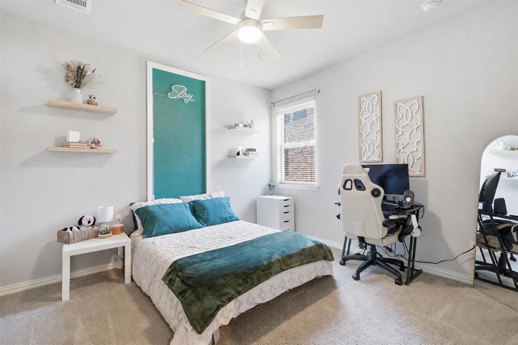 2908 Winding Ridge Court Oak Point, TX 75068 - Photo 26 of 38 Secondary bedroom with some accent work, walk in closet and spacious!