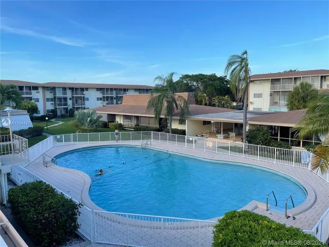 a view of a swimming pool with a patio