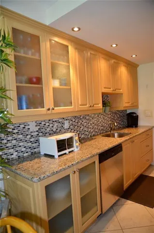 a kitchen with a stove and a sink