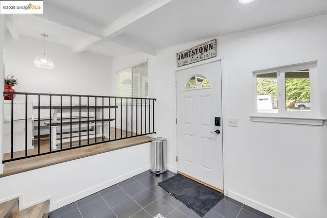 a spacious bathroom with a double vanity sink and a mirror