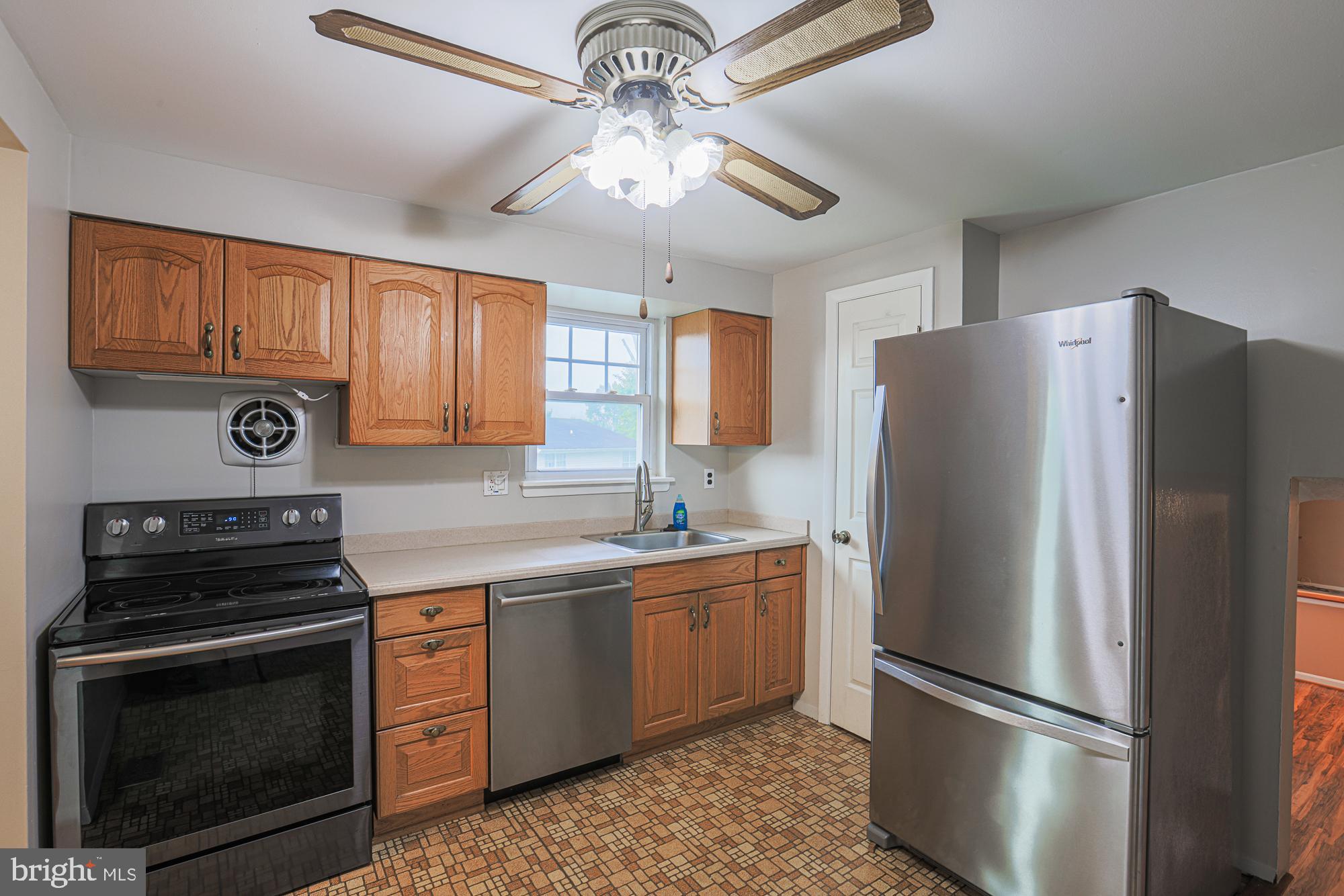 3923 Millner Road Baltimore, MD 21236 - Photo 12 of 38 a kitchen with stainless steel appliances granite countertop a refrigerator sink and cabinets