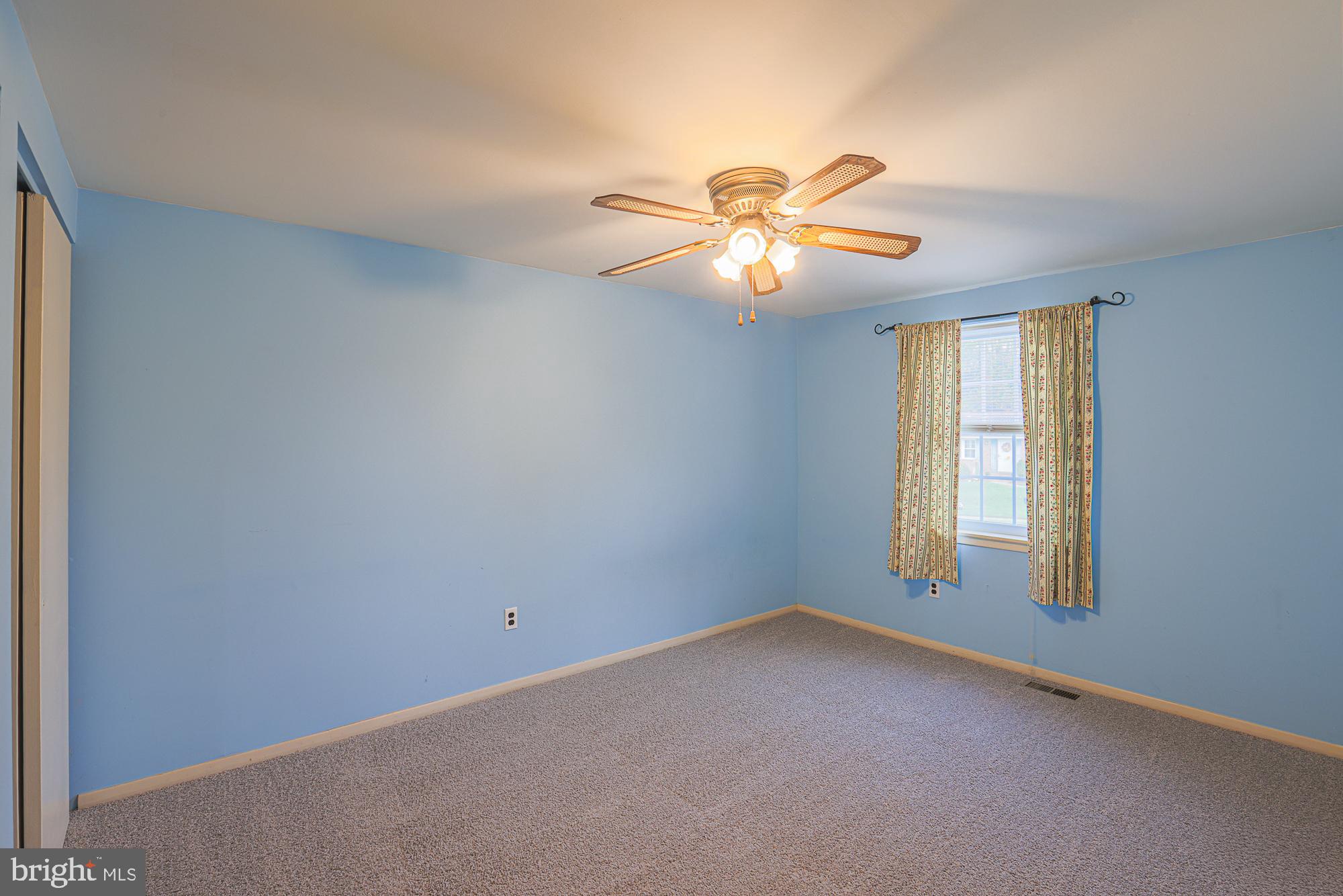 3923 Millner Road Baltimore, MD 21236 - Photo 22 of 38 a view of room with window and ceiling fan