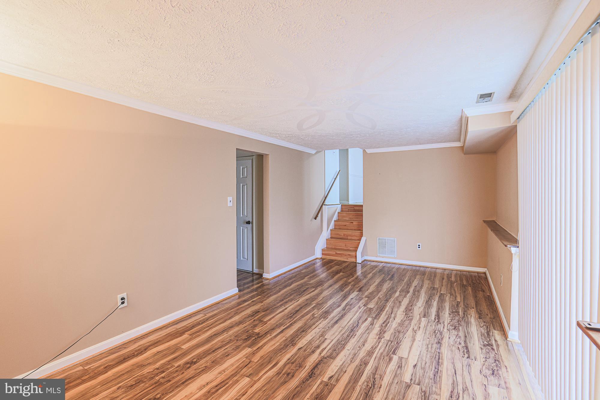 3923 Millner Road Baltimore, MD 21236 - Photo 26 of 38 a view of an empty room with wooden floor